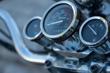 Dashboard of a sports motorcycle, with speedometer and tachometer, close up.