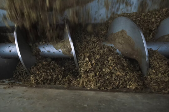 mill's shnek screw picks up the sawdust for their subsequent tra