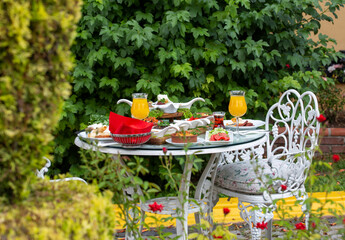 flowering garden and breakfast table
