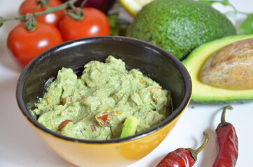 Girl make a sandwich Guacamole and bread. Toast with avocado on white background. Homemade Mexican healthy vegan food