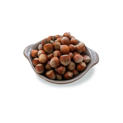 Hazelnuts in a shell on a grey plate isolated object minimalist concept of healthy food diet and eco-friendly lifestyle