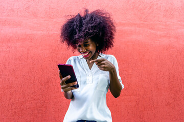 happy African American with phone in hand