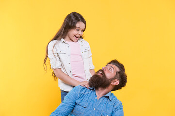 Obraz premium Father and happy little daughter having fun, surprise concept
