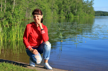 Fototapeta na wymiar woman resting by the lake