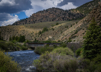 Fototapeta na wymiar Abandoned Train Bridge Over Water in the Rocky Mountains