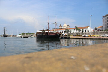 Fototapeta na wymiar Beautiful view of the port of Cartagena - Old wooden ship - Colonial buildings within the walled city.