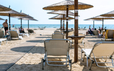 Half-empty beach bar during coronavirus pandemic in Greece