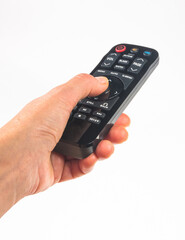 hand holding a remote control on white background, close-up