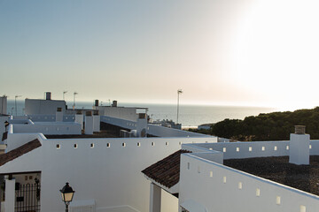 Conil de la Frontera, Spain-16.15.2020: Andalusian town street in Conil de la frontera with white houses © Enrique