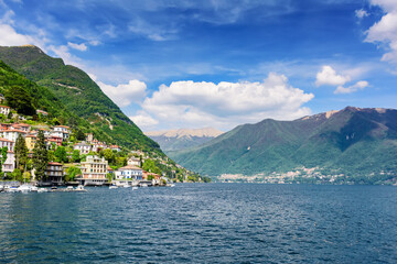 Fototapeta na wymiar Lake Como view of the surrounding mountains and coastal cities. Italy