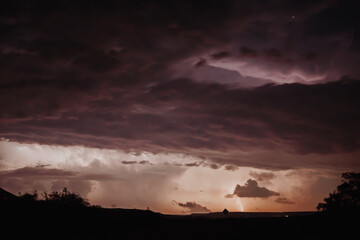 landscape at night with storm clouds and lightning