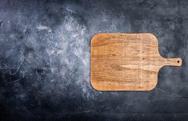 Pizza cutting board on dark background