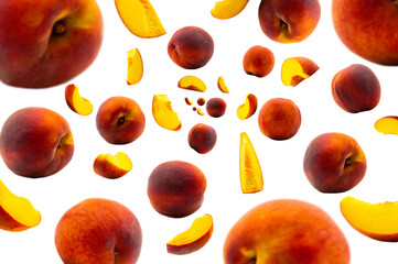 Falling fresh real peach isolated on white background. Selective focus