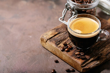 Fototapeta na wymiar Fresh coffee in glass cup
