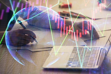 Double exposure of businesswoman hands typing on computer and forex chart hologram drawing. Financial analysis concept.