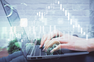 Multi exposure of woman hands typing on computer and forex chart hologram drawing. Stock market analysis concept.