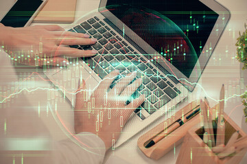 Multi exposure of woman hands typing on computer and forex chart hologram drawing. Stock market analysis concept.