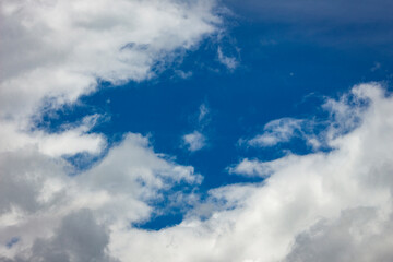 Naklejka na ściany i meble White clouds in blue sky background.