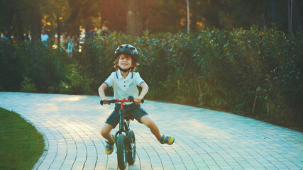 little boy riding a bike