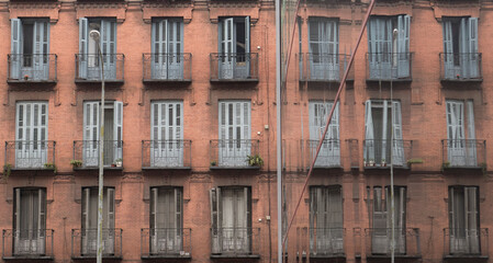 Obraz premium old balconies with mirror wooden shutters