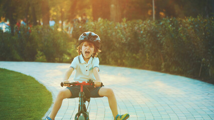 little boy riding a bike