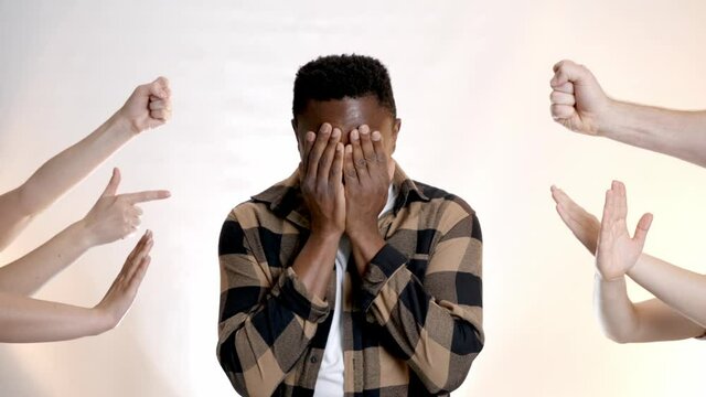 People bullying African-American man on white background. Stop racism