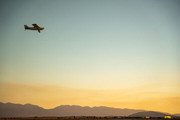 Fototapeta na wymiar Private plan flying over El Mirage dry lakebed in California