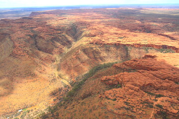 An incredible aerial view over the dry desert landscape of George Gills Range and Kings Canyon, Northern Territory, Australia
