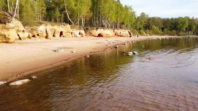 Red sandstone cliffs at Baltic sea coast Veczemju klintis aerial view