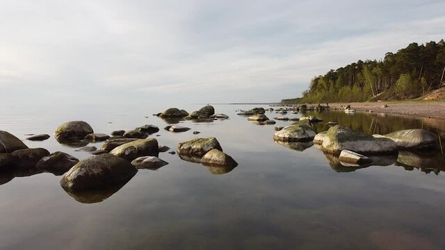 Stones in the sea at Baltic sea coast Veczemju klintis aerial view
