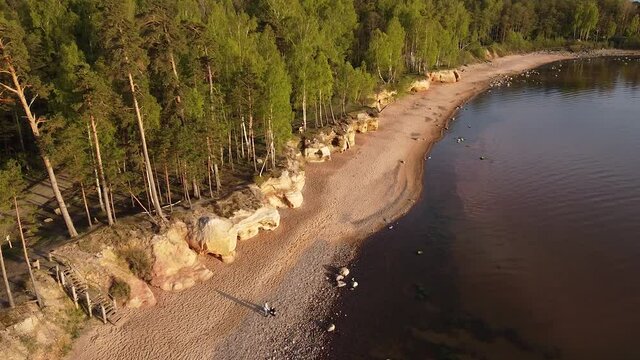 Red sandstone cliffs at Baltic sea coast Veczemju klintis aerial view