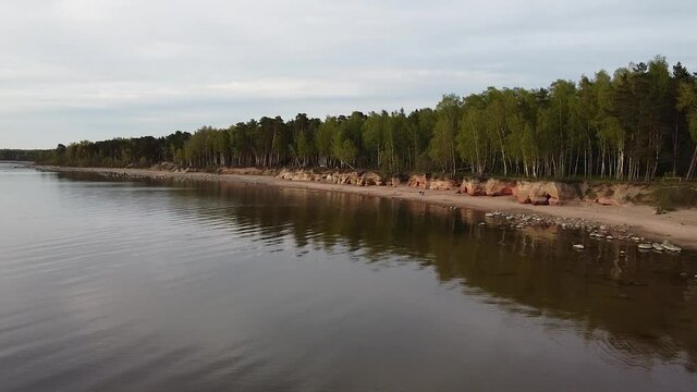 Red sandstone cliffs at Baltic sea coast Veczemju klintis aerial view