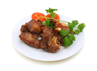 Beef ribs with tomato on white background
