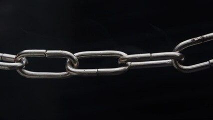 Weakest Link - Concept - Real Chain slowly heats up and starts to sparkle, then the weakest link finally breaks and then the rest of the chain breaks.
