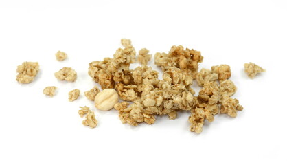 Pile of granola from above isolated on a white background. CRUNCHY hazelnut muesli isolated.
