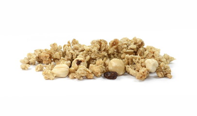 Pile of granola from above isolated on a white background. CRUNCHY hazelnut muesli isolated.