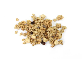 Pile of granola from above isolated on a white background. CRUNCHY hazelnut muesli isolated.