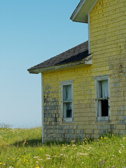 Picturesque abandoned yellow house on Magdalen Islands, Quebec