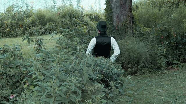 1900s man looking at undeveloped land