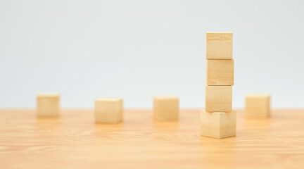 empty wooden cubes for own messages and icons on wooden floor and white background