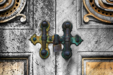 Lock and door handles on a crypt in a cemetery