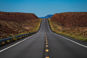 American roadtrip. Panoramic skyline with empty road.
