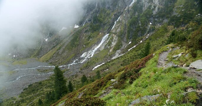 Stubai, Austria. Outdoor hiking path in beautiful valley with Sulzenau Waterfall