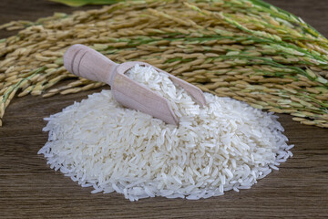 White rice (jasmine rice) on a wooden background