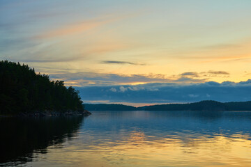 A colofrul sunset with reflections on water in an archipelago in Parainen, Finland.