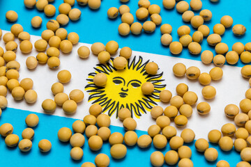 Flag of Argentina covered in soybeans. Concept of South America agricultural imports, exports, trade, trade war, tariffs, production and commodity markets
