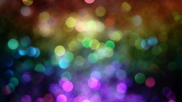 Rainbow bokeh glitter / sparkle / particle explosion background texture / shot in slow motion at 960fps