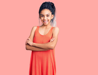 Cute african american girl wearing casual clothes happy face smiling with crossed arms looking at the camera. positive person.