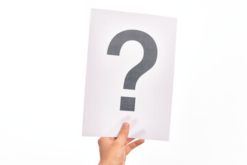 Hand of caucasian young man holding paper showing question mark over isolated white background