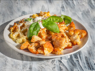 Breakfast with chicken fried meat and zucchini waffles and basil leaves